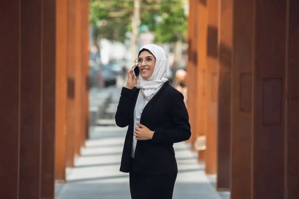 talking-phone-beautiful-muslim-successful-businesswoman-portrait-confident-happy-ceo-leader-boss-manager-using-devices-gadgets-working-go-looks-busy-charming-inclusive-diversity_155003-41898